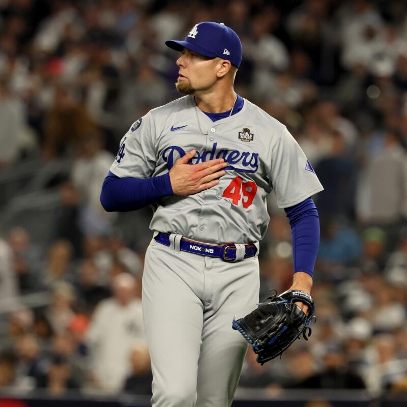 Dodgers reliever Blake Treinen pounds his chest after the final out of the seventh inning.