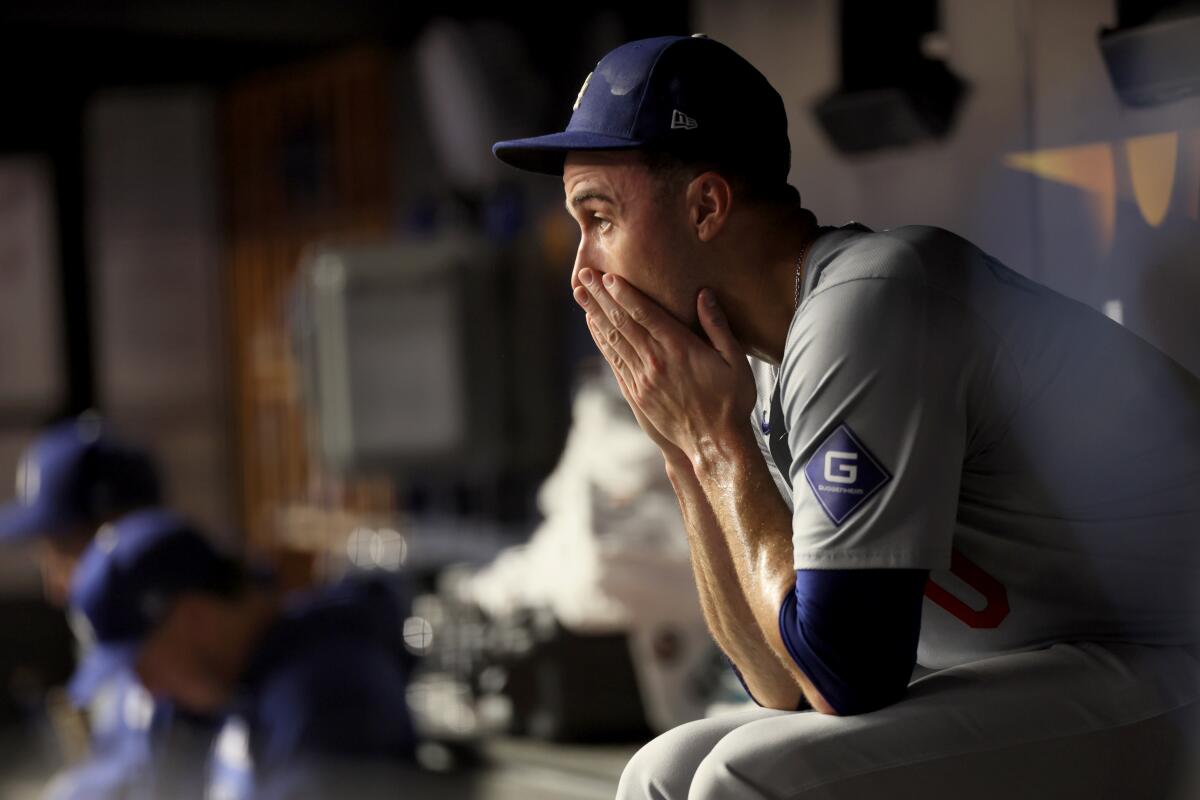 Dodgers pitcher Jack Flaherty sits in the dugout after being pulled in Game 5.