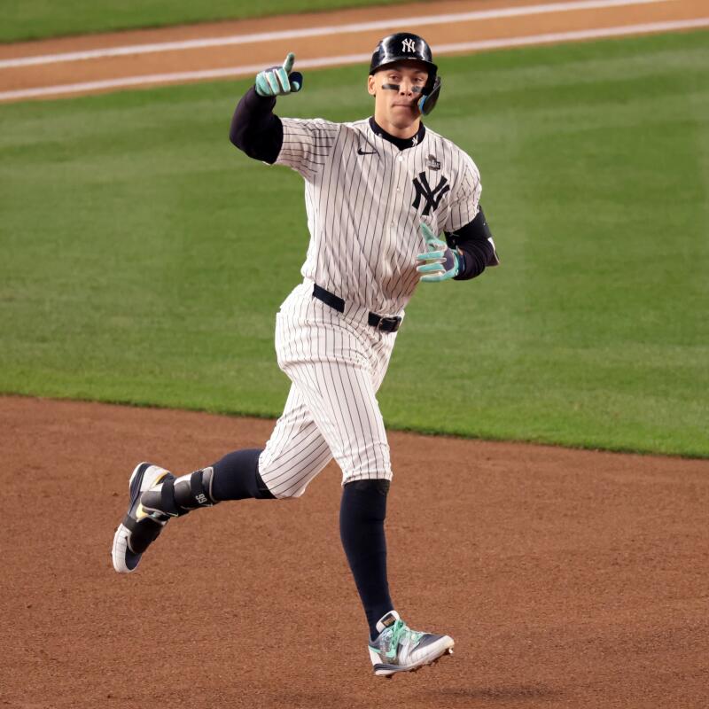 New York Yankees star Aaron Judge celebrates after hitting a two-run home run in the first inning.