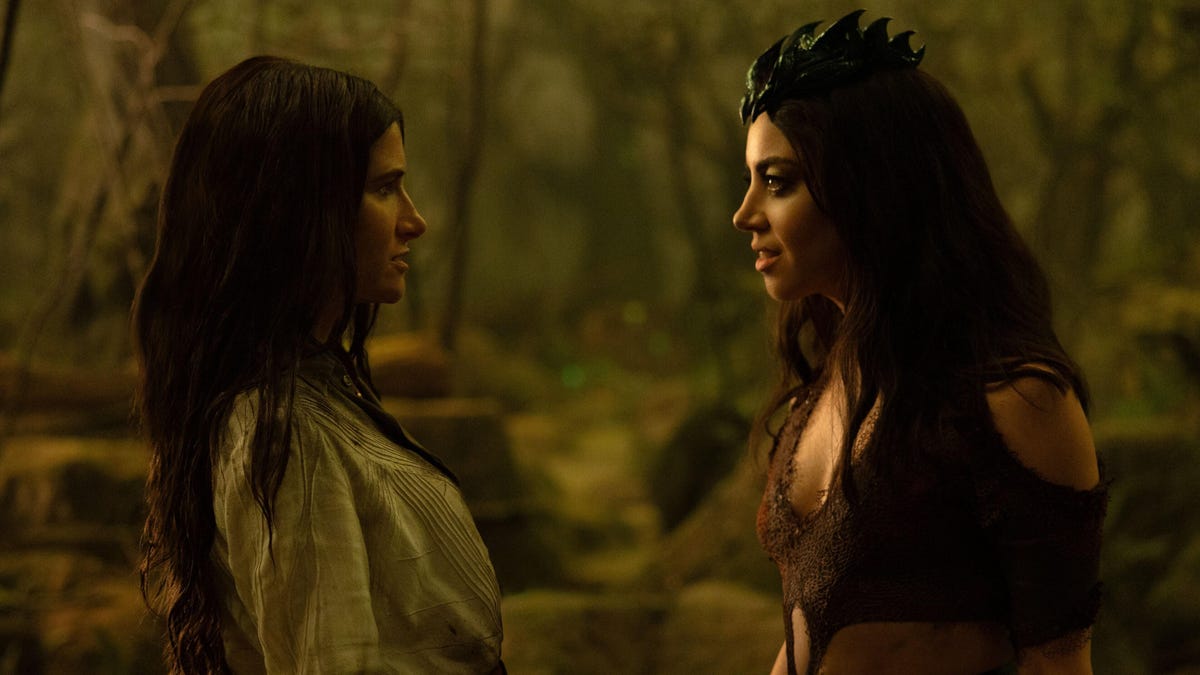 Kathryn Hahn's Agatha and Aubrey Plaza's Rio look at each other in the middle of the woods