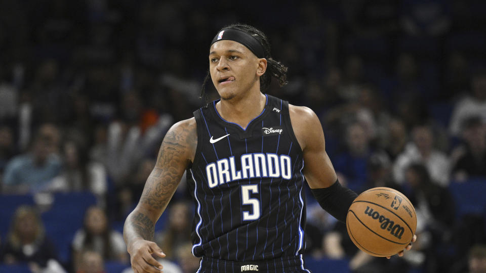 Orlando Magic forward Paolo Banchero (5) brings the ball up the court against the Indiana Pacers during the first half of an NBA basketball game, Monday, Oct. 28, 2024, in Orlando, Fla. (AP Photo/Phelan M. Ebenhack)